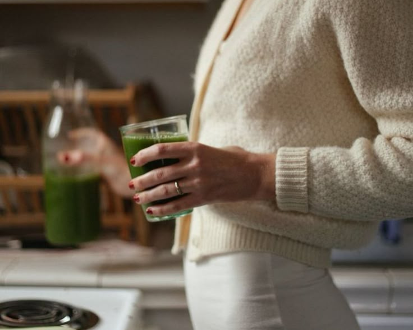 Winter Wellness Hacks Woman Holding Green Juice